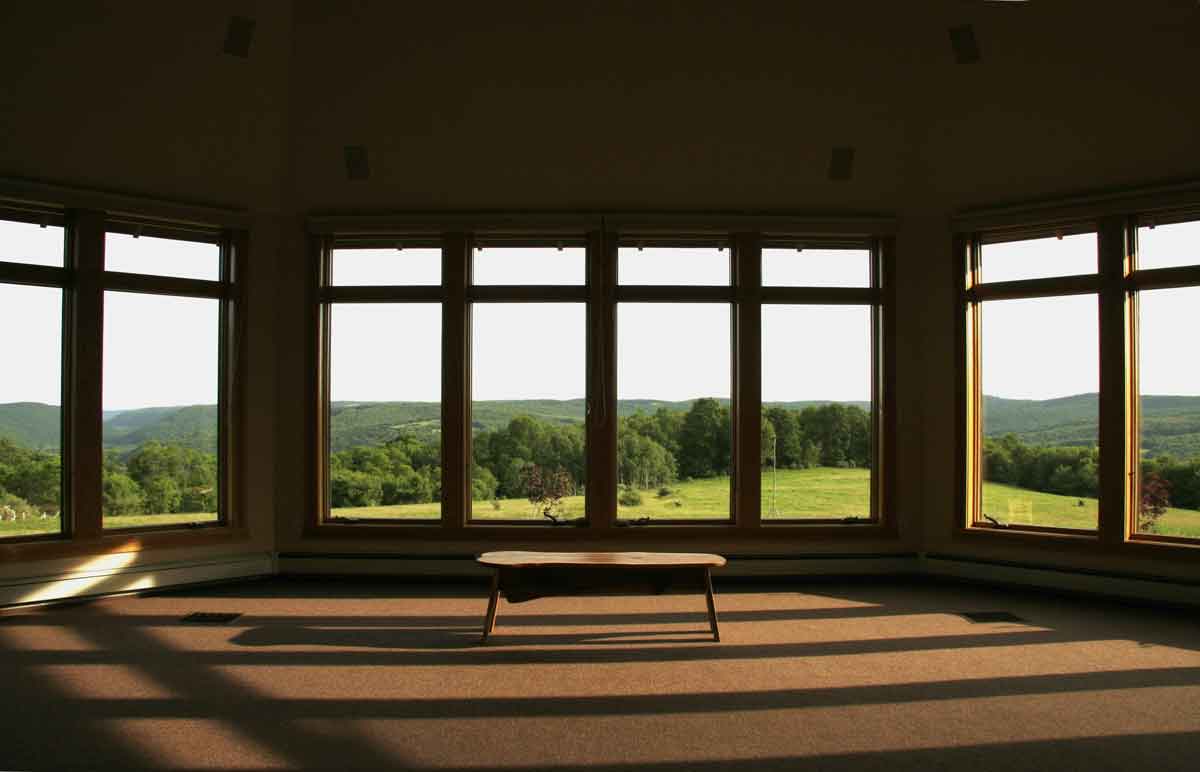 view of the hills from inside the lodge at light on the hill