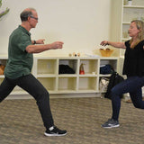 Philip and workshop participant doing a lunge